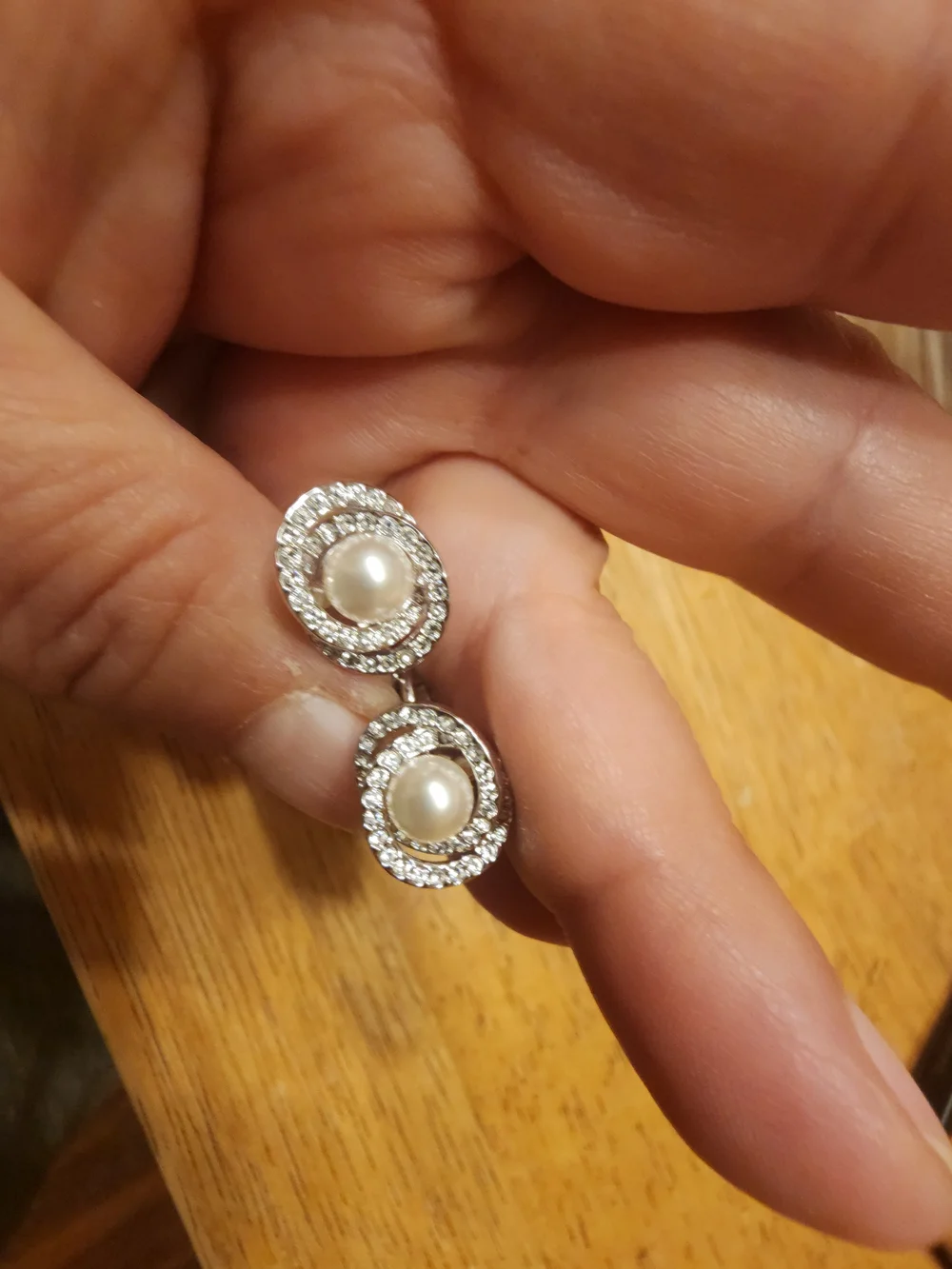 classic Swarovski Crystal Pearl clip ons featuring a central cream faux pearl